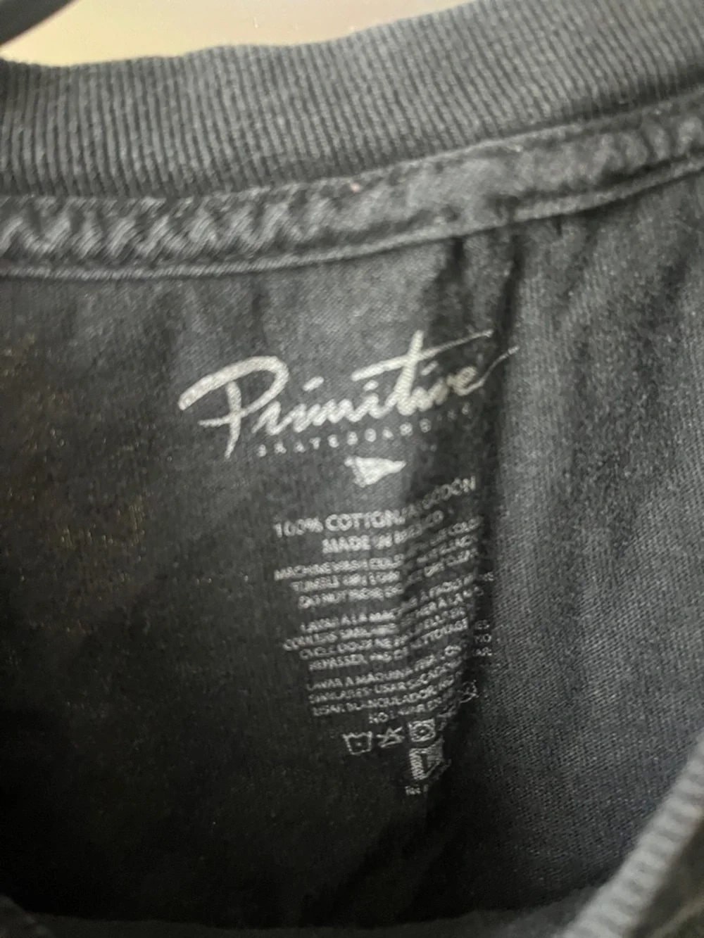 Primitive Black Tee with Blue and Yellow Block Logo